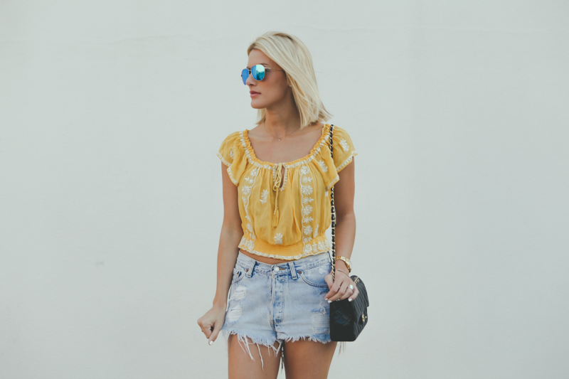 yellow embroidered off the shoulder blouse