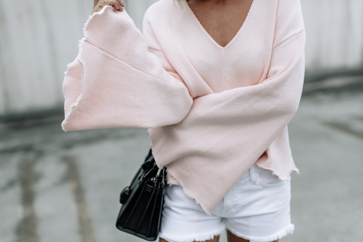 pink raw edge flare sleeved top