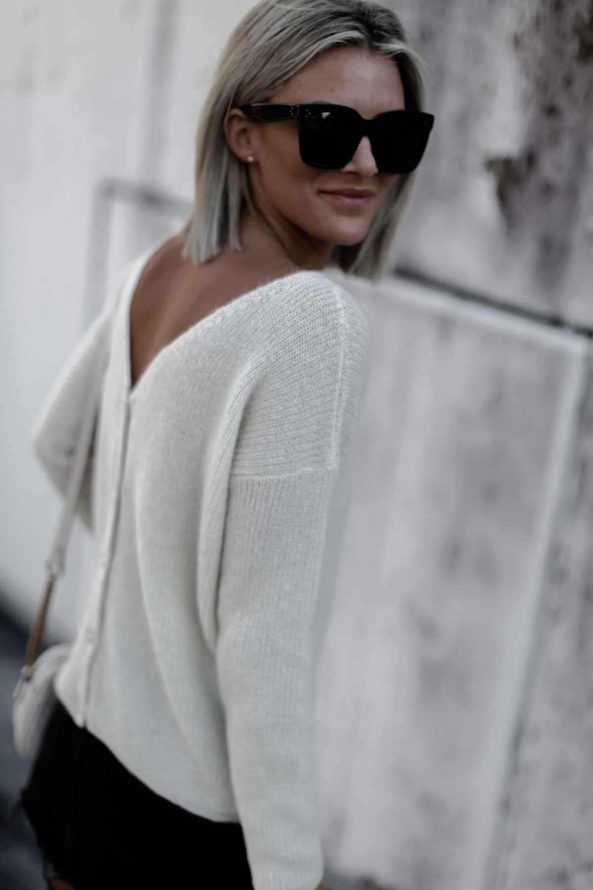 A classic cream sweater on blogger So Sage