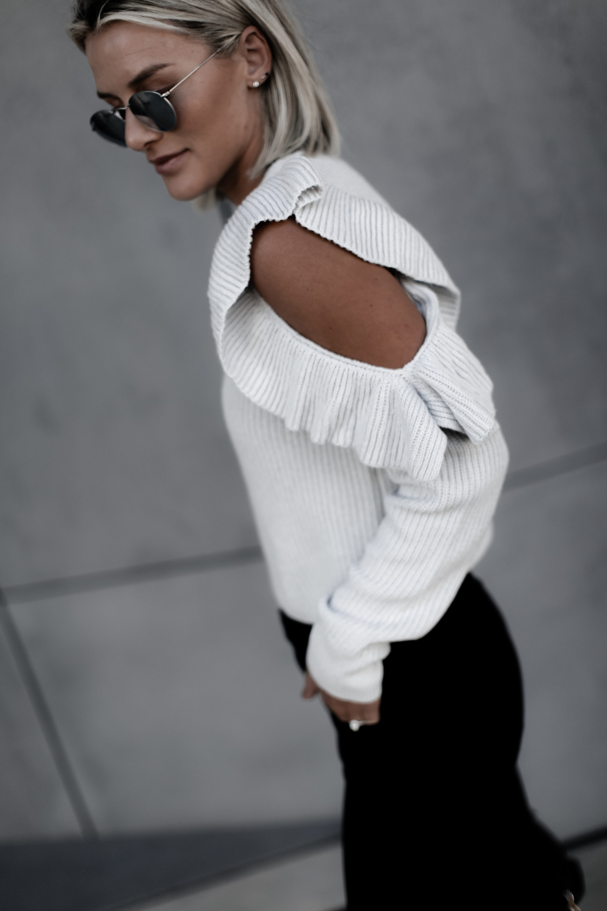 blogger So Sage wearing a cute ruffle cold shoulder sweater
