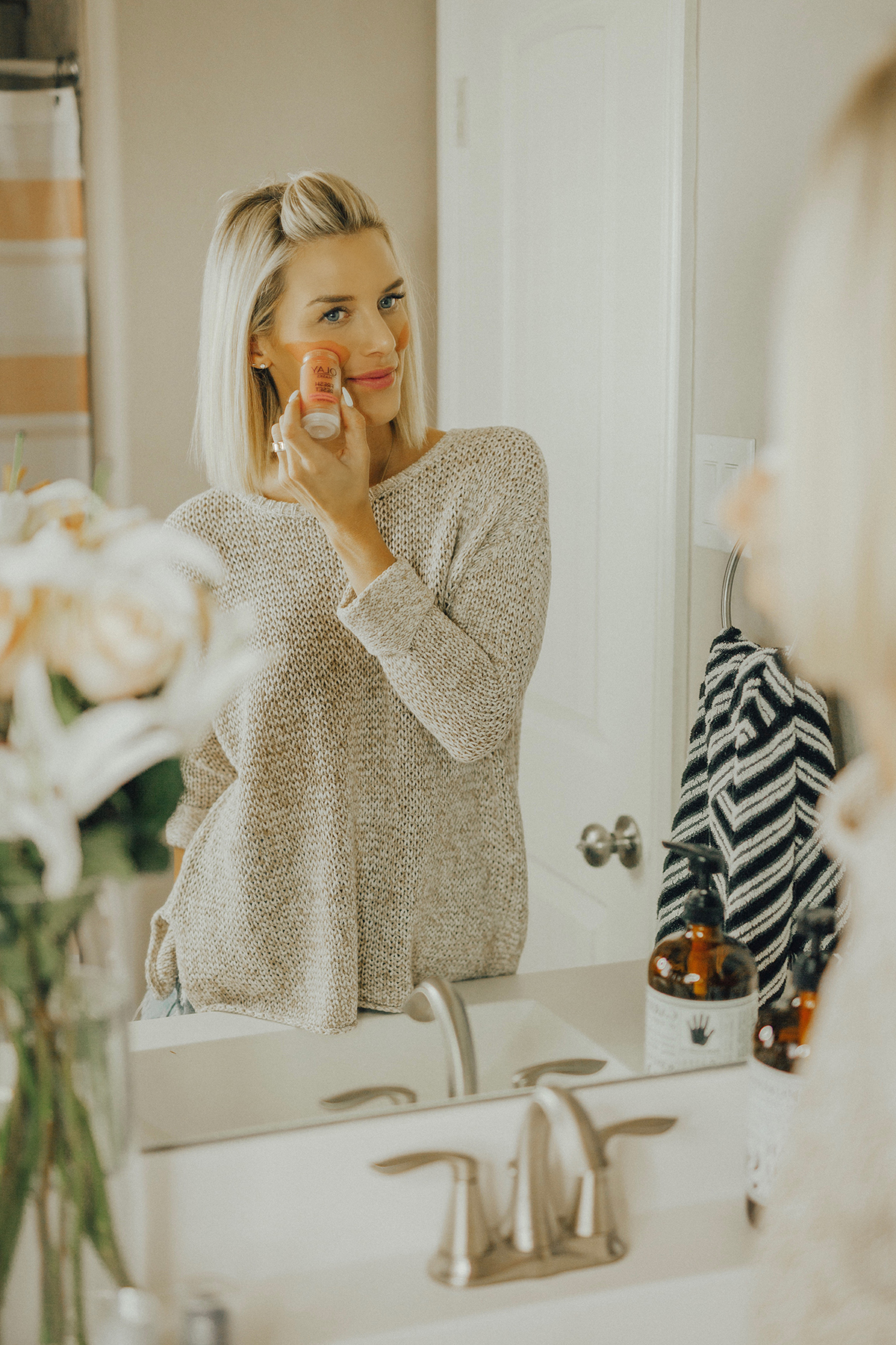 Blogger Sage Coralli reveiwing the new Olay clay stick masks 