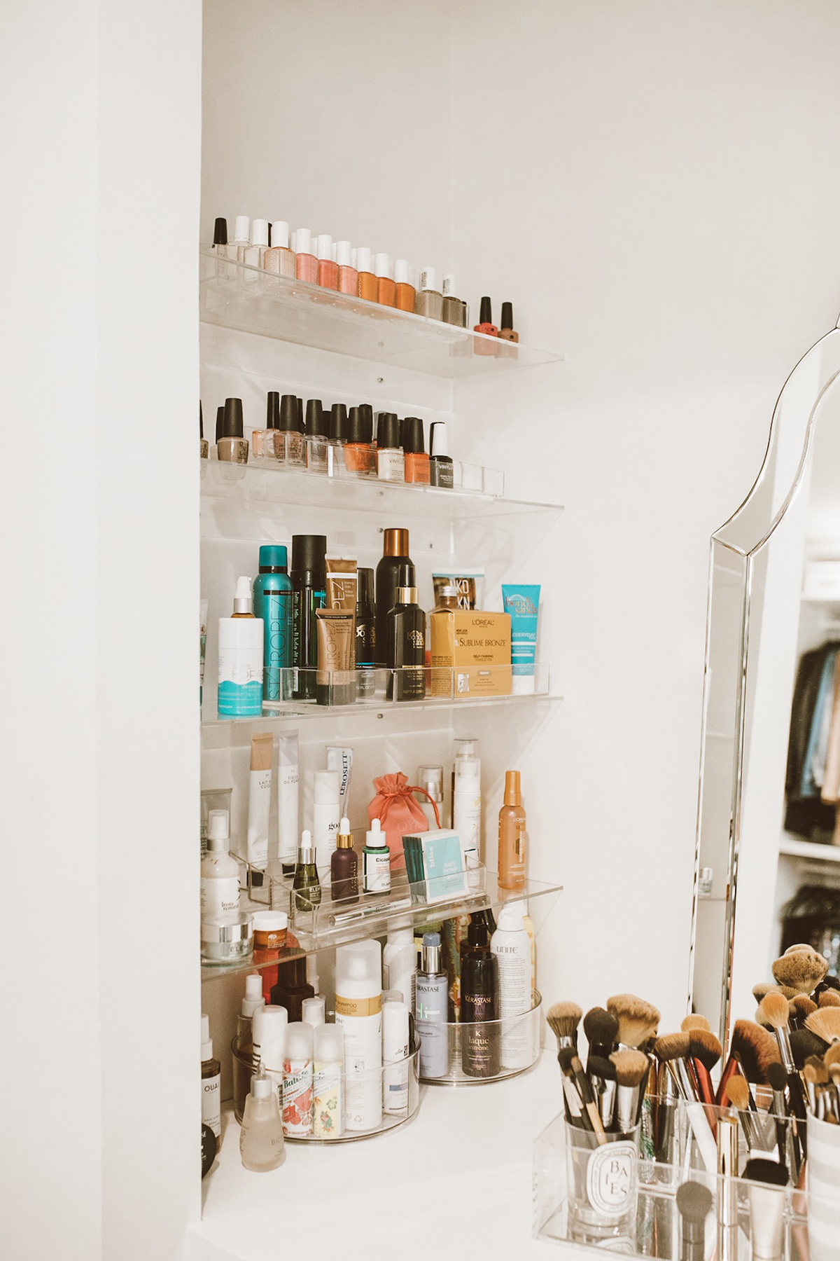 blogger So Sage used lucite organizers from the Container Store to organize her vanity area