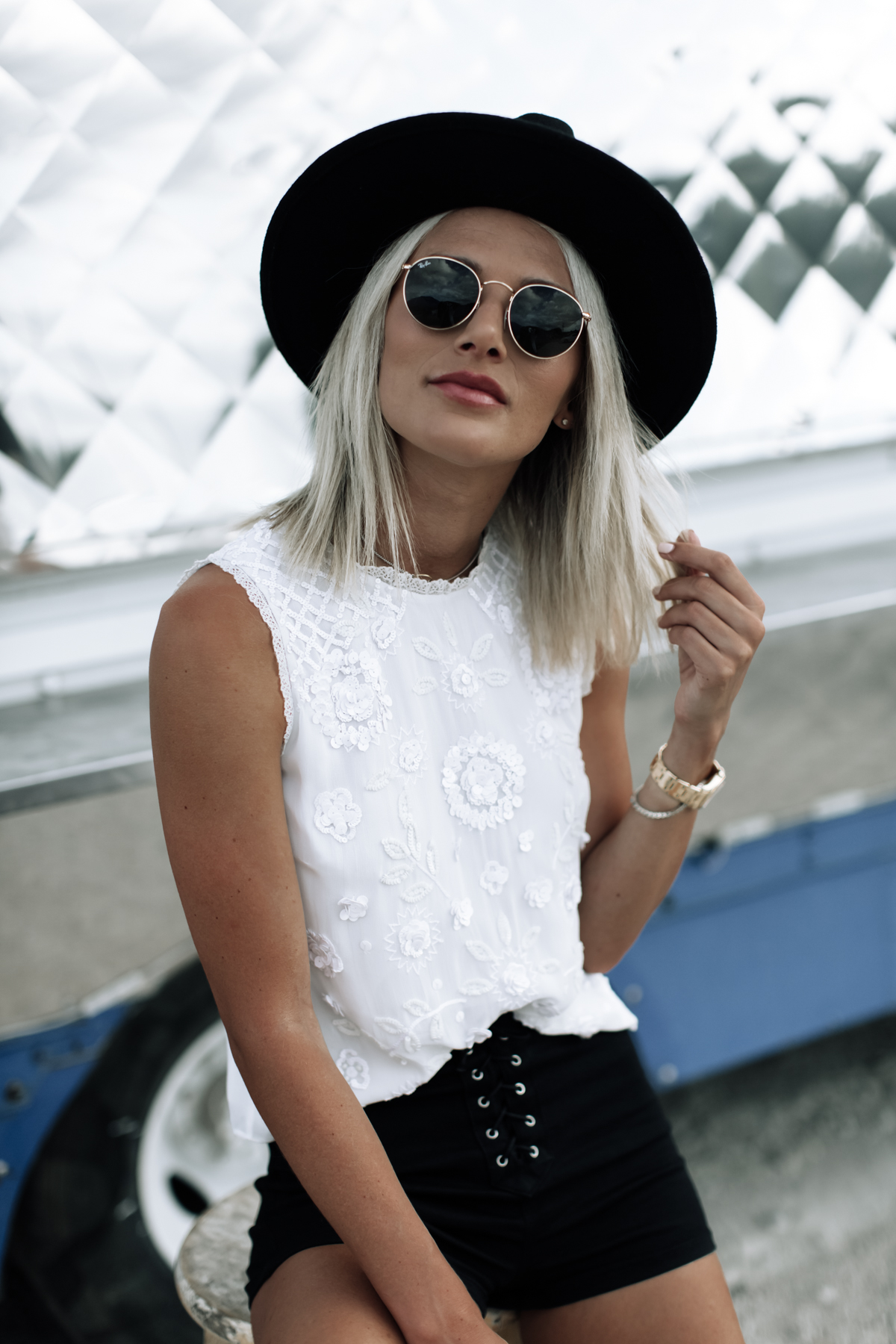 white sequin tank top and black fedora hat festival outfit