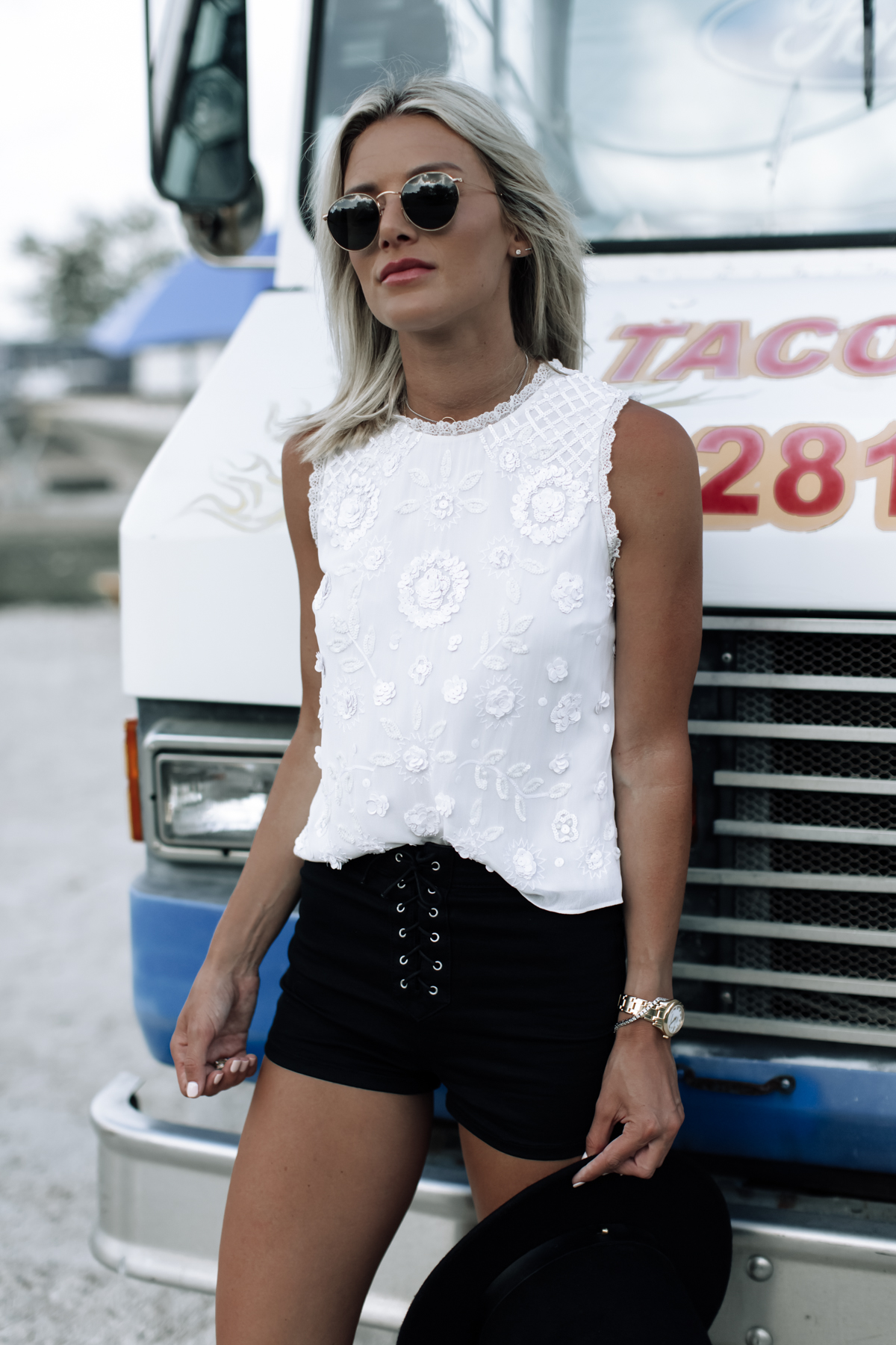 white sequin top and black shorts festival outfit