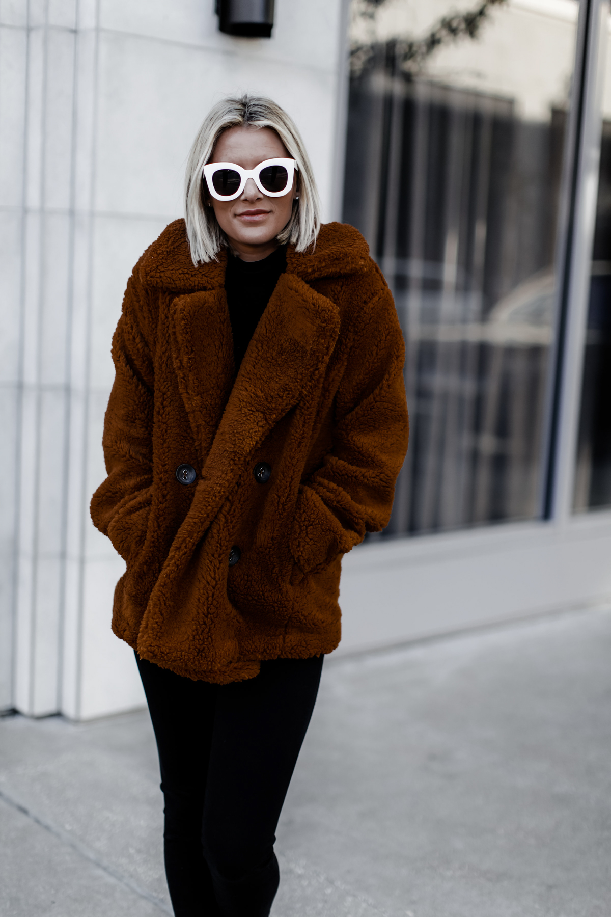 Blogger Sage Coralli in an oversized cozy Free People peacoat
