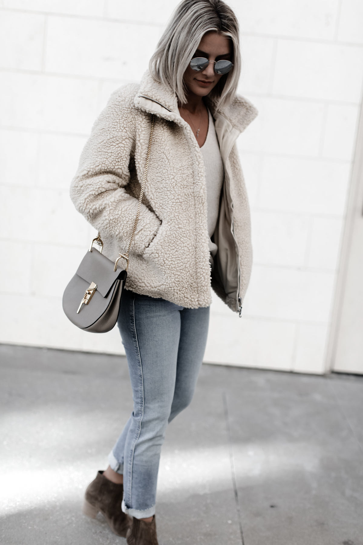 pile coat paired with jeans on Sage Coralli of So Sage Blog