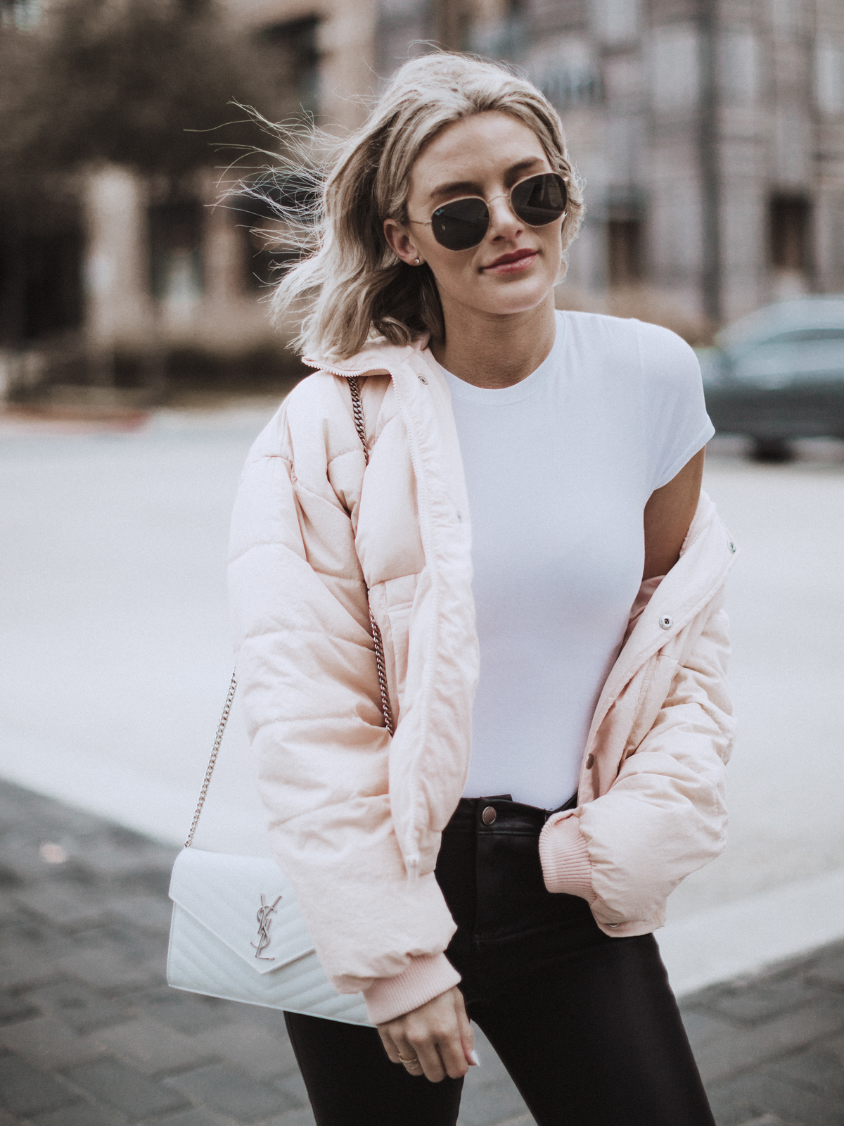 Sage Coralli of So Sage Blog in a free people puffer coat