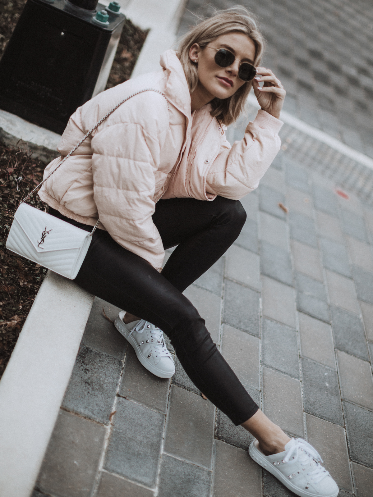 Sage Coralli in a blush pink puffer jacket