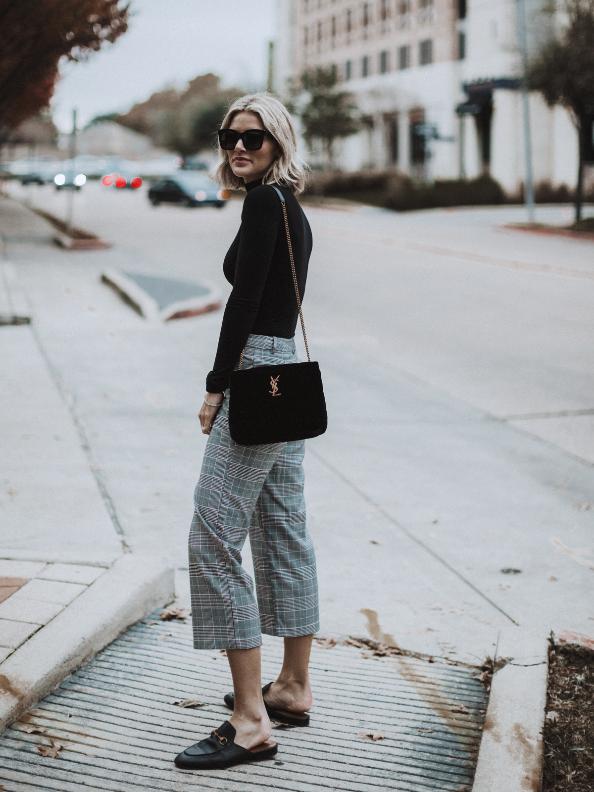 blogger So Sage wearing plaid pants and gucci loafers