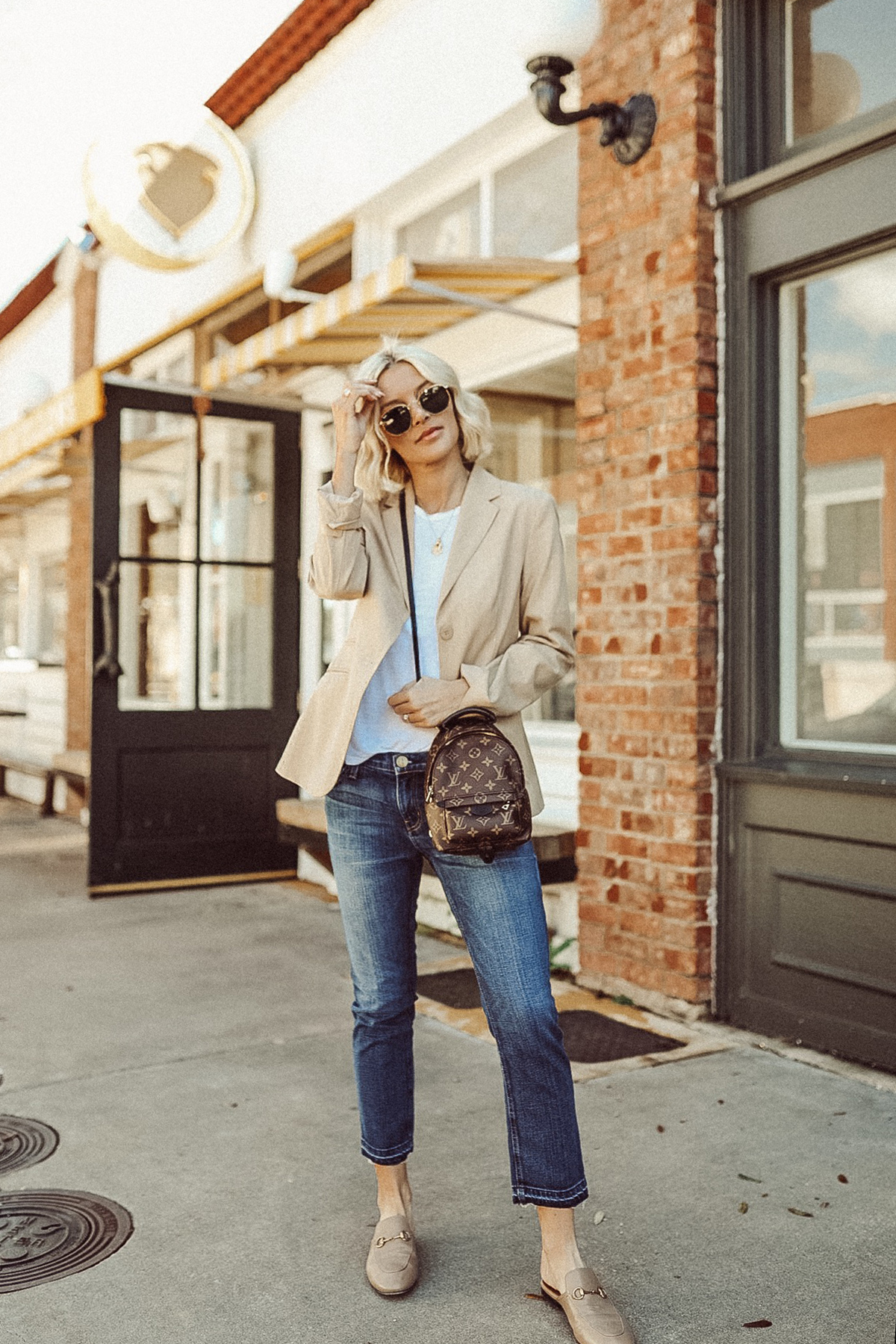 a cute secondhand casual outfit wearing jeans and a nude blazer